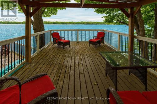 Could be perfect for your lakeside sunset dinners - 66 Scott Lane, Rideau Lakes, ON - Outdoor With Body Of Water With Deck Patio Veranda With View