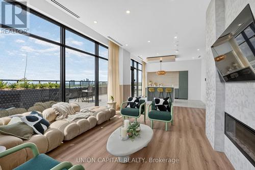 910 - 1660 Bloor Street W, Toronto, ON - Indoor Photo Showing Living Room With Fireplace
