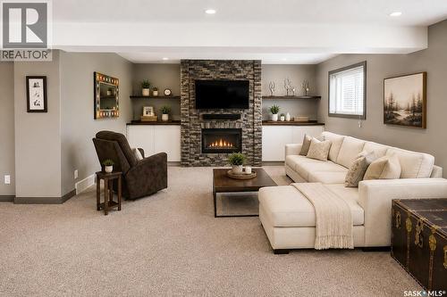 1 Glen Howard Way, Prince Albert, SK - Indoor Photo Showing Living Room With Fireplace