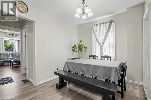 Recessed lighting, wood-finish flooring, and a multi-light ceiling fixture enhance this dining space - 16 Mercer Road, Cambridge, ON - Indoor