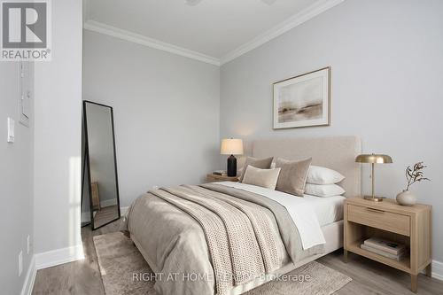 *Virtual Staged* Primary Bedroom - 303 - 35 Brian Peck Crescent, Toronto, ON - Indoor Photo Showing Bedroom