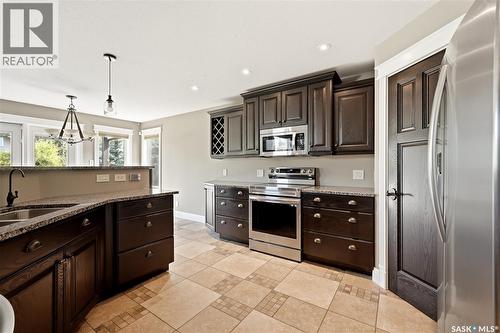 7 Lott Road E, White City, SK - Indoor Photo Showing Kitchen With Double Sink