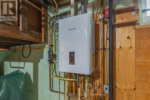 owned boiler/hot water on demand - 215 Knoll Street, Port Colborne (Main Street), ON - Indoor Photo Showing Basement