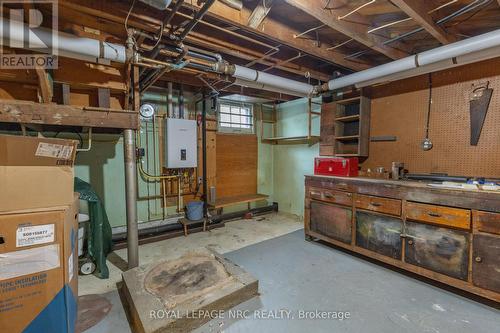 large workbench - 215 Knoll Street, Port Colborne (Main Street), ON - Indoor Photo Showing Basement