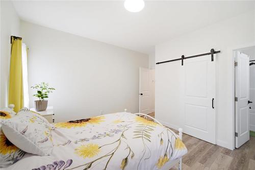 Primary Bedroom (Main Floor) - 223 Harmony Lane, Steinbach, MB - Indoor Photo Showing Bedroom