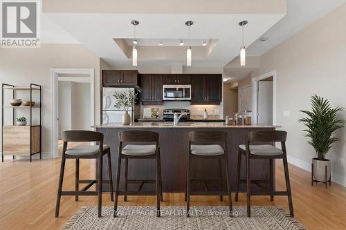 Virtually enhanced to show your guests - 1003 - 245 Kent Street N, Ottawa, ON - Indoor Photo Showing Kitchen With Upgraded Kitchen