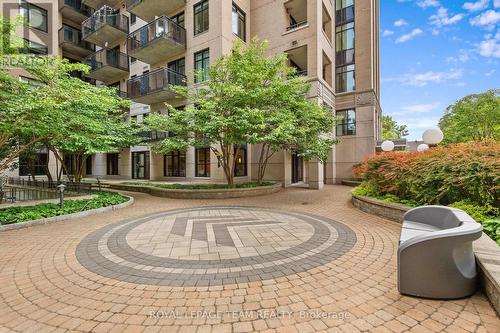 Ground level common patio for relaxation - 1003 - 245 Kent Street N, Ottawa, ON - Outdoor With Balcony