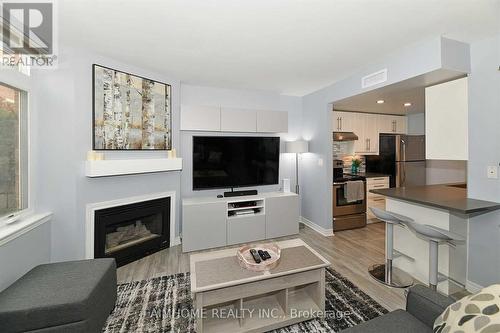 1 - 100 Redpath Avenue, Toronto, ON - Indoor Photo Showing Living Room With Fireplace