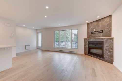 Living Room - 3311 Rue Mistral, Brossard, QC - Indoor Photo Showing Living Room With Fireplace