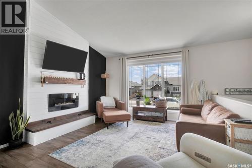 710 Redwood Crescent, Warman, SK - Indoor Photo Showing Living Room With Fireplace