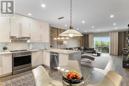 507 - 60 Wyndham Street S, Guelph (St. Patrick'S Ward), ON - Indoor Photo Showing Kitchen With Stainless Steel Kitchen With Upgraded Kitchen