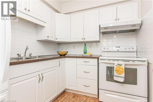 24 Midland Drive Unit# 402, Kitchener, ON - Indoor Photo Showing Kitchen With Double Sink