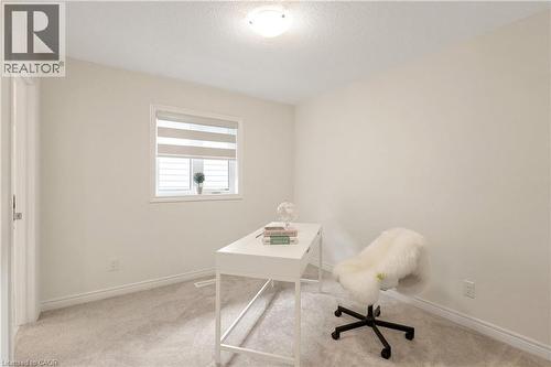 Recessed window with horizontal blinds, overhead ceiling light fixture, and plush carpet flooring - 285 Broadacre Drive, Kitchener, ON - Indoor Photo Showing Office