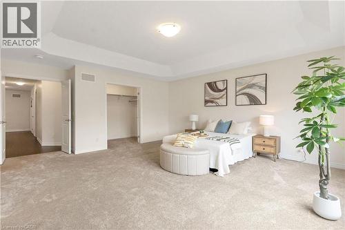 Recessed ceiling with central lighting, neutral carpet flooring, and open closet space - 285 Broadacre Drive, Kitchener, ON - Indoor Photo Showing Bedroom