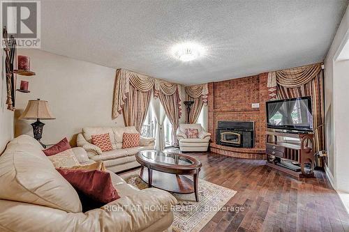 4326 Bridlepath Trail, Mississauga, ON - Indoor Photo Showing Living Room With Fireplace
