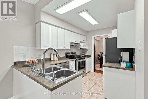 26 Milner Downs Crescent, Ottawa, ON - Indoor Photo Showing Kitchen With Double Sink