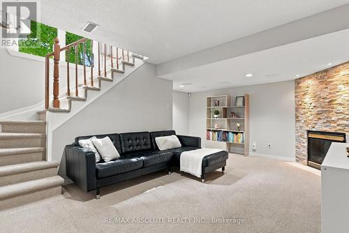 26 Milner Downs Crescent, Ottawa, ON - Indoor Photo Showing Living Room With Fireplace