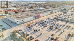 Expansive commercial property with a large, paved parking area - 