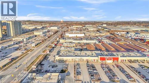 Aerial perspective showcasing commercial properties, surface parking, and multi-lane roadways - 589 Fairway Road S, Kitchener, ON 