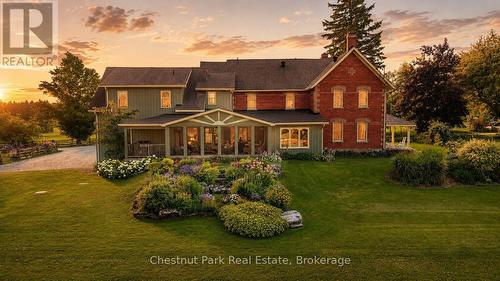 AI enhanced to create sunset setting - 678541 Centre Road, Mulmur, ON - Outdoor With Deck Patio Veranda