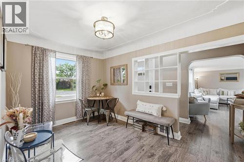 Interior dining area featuring wood-finish flooring, neutral wall tones, and crown molding - 481 Upper Gage Avenue, Hamilton, ON - Indoor