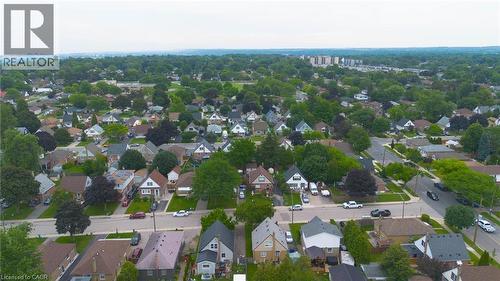 Aerial perspective highlighting a residential neighbourhood with diverse architectural styles, mature trees, and paved roadways - 481 Upper Gage Avenue, Hamilton, ON - Outdoor With View