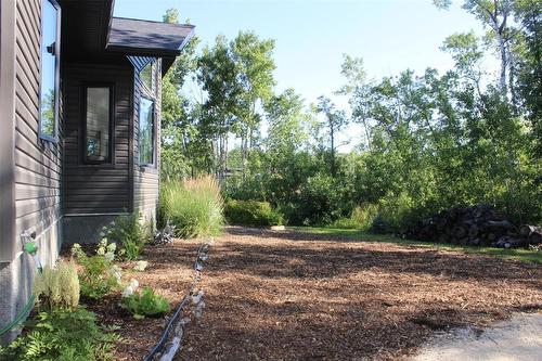 These trees provide privacy and shade. It's like being in a park on this property! - 7 Dalvik Road, Gimli Rm, MB - Outdoor