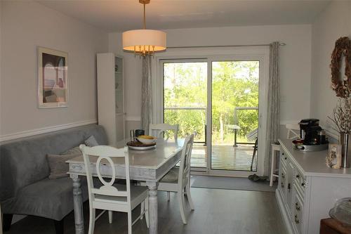 The dining room can accommodate a large table and has plenty of room for a china cabinet or buffet hutch as seen. - 7 Dalvik Road, Gimli Rm, MB - Indoor Photo Showing Dining Room