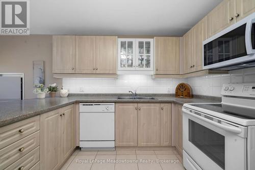 210 - 2075 Amherst Heights Drive, Burlington (Brant Hills), ON - Indoor Photo Showing Kitchen With Double Sink