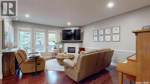 3107 Andreychuk Place E, Regina, SK - Indoor Photo Showing Living Room With Fireplace
