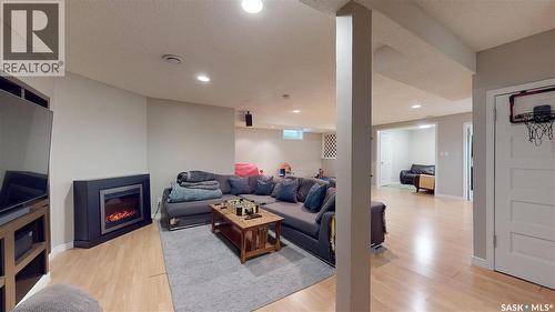 3107 Andreychuk Place E, Regina, SK - Indoor Photo Showing Other Room With Fireplace