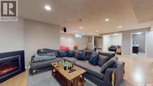 3107 Andreychuk Place E, Regina, SK - Indoor Photo Showing Living Room With Fireplace