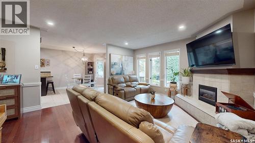 3107 Andreychuk Place E, Regina, SK - Indoor Photo Showing Living Room With Fireplace