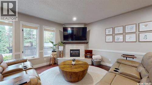 3107 Andreychuk Place E, Regina, SK - Indoor Photo Showing Living Room With Fireplace