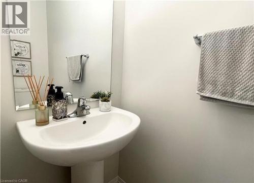White pedestal sink with chrome faucet - 17 Visionary Avenue, Kitchener, ON - Indoor Photo Showing Bathroom