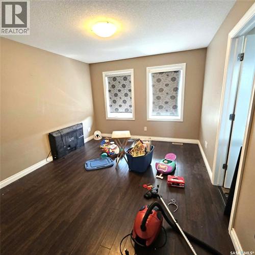 5008 Aerial Crescent, Regina, SK - Indoor With Fireplace