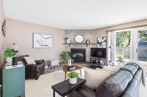 66 Hawkins Cr, Winnipeg, MB - Indoor Photo Showing Living Room With Fireplace