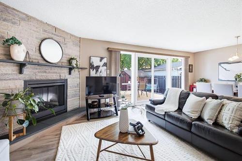 66 Hawkins Cr, Winnipeg, MB - Indoor Photo Showing Living Room With Fireplace