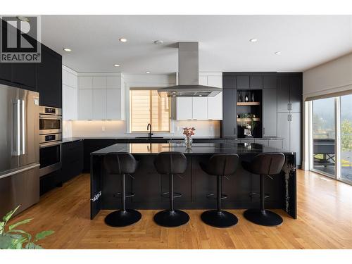 Take a seat family - 7261 Silver Ridge Drive, Vernon, BC - Indoor Photo Showing Kitchen With Upgraded Kitchen