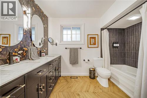 Dual vanity with stone countertop and integrated sinks - 24 Garvey Crescent, Hamilton, ON - Indoor Photo Showing Bathroom