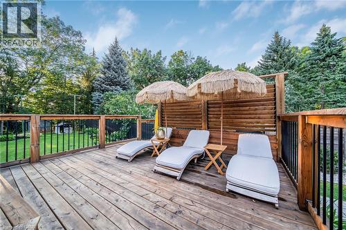 Expansive wood deck with a privacy fence, wood railings, and black metal balusters - 24 Garvey Crescent, Hamilton, ON - Outdoor With Deck Patio Veranda With Exterior