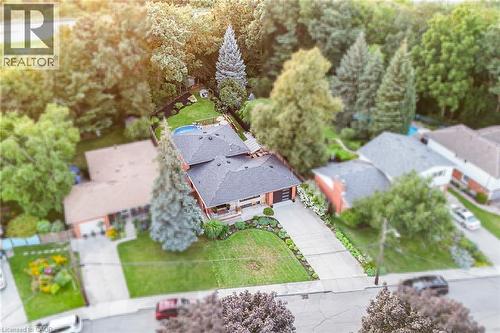 Two-story residence with a dark shingle roof, attached garage, and a concrete driveway - 24 Garvey Crescent, Hamilton, ON - Outdoor With View