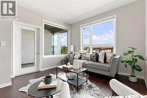 206 225 Maningas Bend, Saskatoon, SK - Indoor Photo Showing Living Room