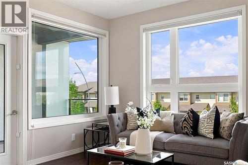 206 225 Maningas Bend, Saskatoon, SK - Indoor Photo Showing Living Room