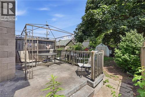 Concrete patio surface with a metal gazebo structure - 56 Harmony Avenue, Hamilton, ON - Outdoor