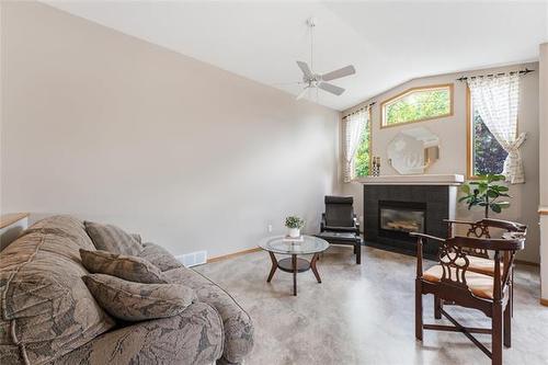 2 Bounty Bay, Winnipeg, MB - Indoor Photo Showing Living Room With Fireplace