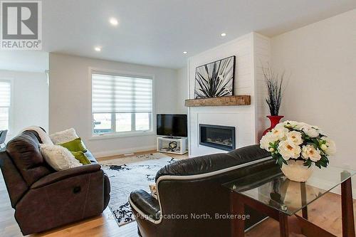 37 Foliage Drive, Tiny, ON - Indoor Photo Showing Living Room With Fireplace