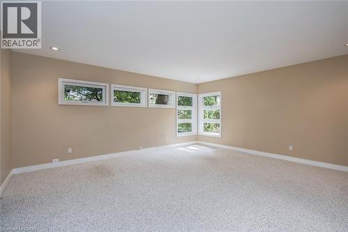 Light-colored carpeting, recessed ceiling lighting, and multiple windows with white trim - 4189 Inglewood Drive, Burlington, ON - Indoor Photo Showing Other Room