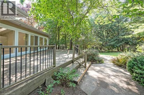 Expansive exterior deck with wood-finish surface and black metal railings - 4189 Inglewood Drive, Burlington, ON - Outdoor