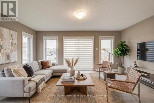 Virtually Staged Living Room photo - 77 John Brabson Crescent, Guelph (Kortright East), ON - Indoor Photo Showing Living Room